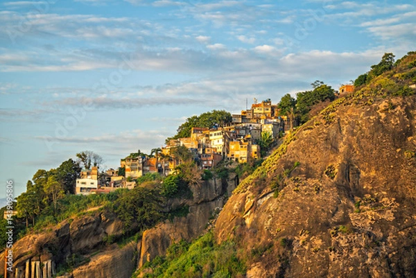 Obraz Typical favela buildings on the steep hill at sunrise in Rio de Janeiro, Brazil