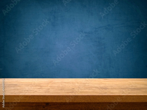 Fototapeta Empty wooden table on blue chalkboard background