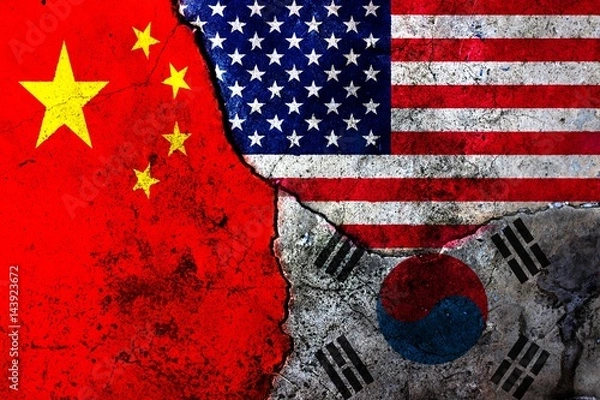 Fototapeta Cracks in the wall. Flags: USA, China, South Korea