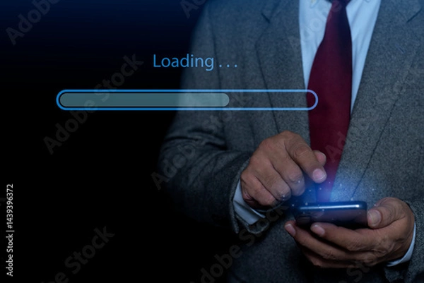 Fototapeta Businessman hand using mobile smartphone for downloading application or digital business data form website and cloud to smartphone