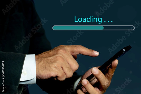 Fototapeta Businessman hand using mobile smartphone for downloading application or digital business data form website and cloud to smartphone