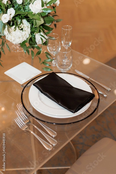 Obraz Table setting, empty plate with napkin and cutlery. Empty white plate, forks, knife and wine glasses on table. Dinner set for one with plates and silverware perfect for dinner or special occasions