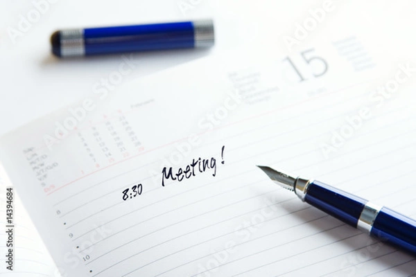Fototapeta pen on a top of day planner