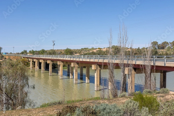 Obraz A road bridge over the connection channel between Lake Pamamaroo and Menindee Lake in the Menindee Lakes system on the Darling River in New South Wales, Australia.