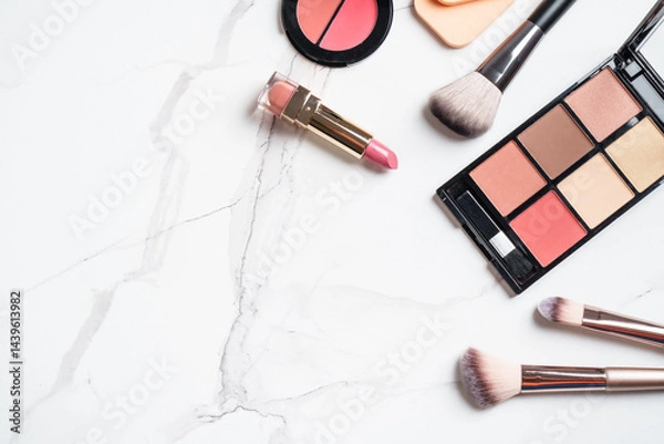 Obraz Make up products at white background. Cosmetic palette, brushes and lipsticks. Top view with copy space.