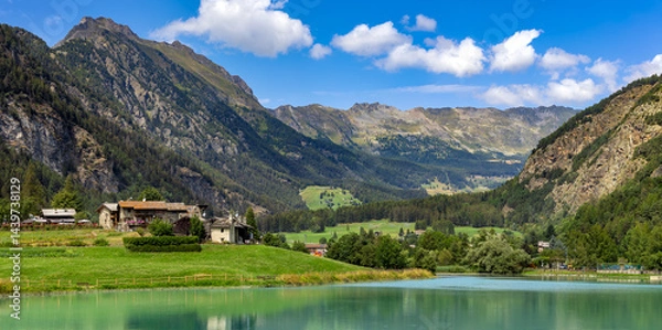 Fototapeta Panoramic view of Lake Brusson surrounded by mountains in Aosta Valley, Italy.