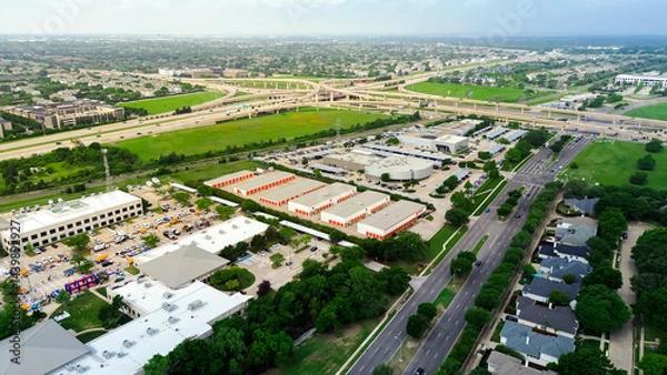 Fototapeta Dallas metroplex multilevel stack interchange road junction, highway, viaduct, mixed use development area of business park campus, storage, auto dealership, residential houses, apartment complex