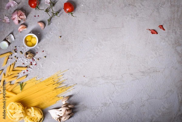 Obraz Pasta with cooking ingredients on grey countertop. Italian recipe. View from above, copy space, flat lay..