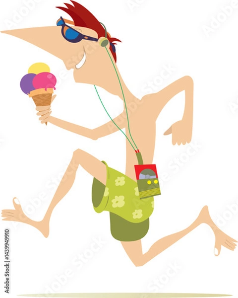 Fototapeta Running young man with an ice cream. 
Running listening music on player using headphones and eating an ice cream
