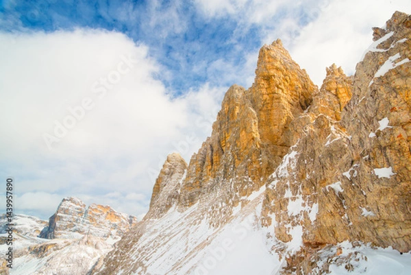 Fototapeta View of the Dolomites, Italy. Mountain landscapes with snow and ice. Sharp rocks as a background. Place for mountain hiking, traveling and vacation. Wallpaper, postcard, photo.