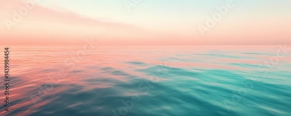 Fototapeta A serene ocean landscape featuring a pastel sky and calm water with gentle ripples and soft color palette