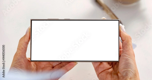 Fototapeta Close-up of woman hand and blank screen tablet pc on white desktop background. Empty display, screen ready for branding. Modern technology usage, online activities and digital marketing concept.