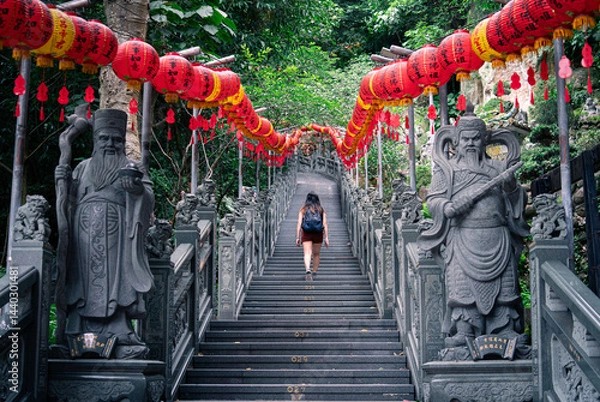 Obraz girl tourist walking up stairs to temple with red lanterns asia