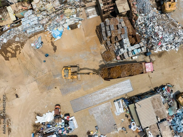 Fototapeta Aerial view of Trash disposal for recycling and re-use. Recycling of Construction rebar  waste or debris Industrial scrap Processing.