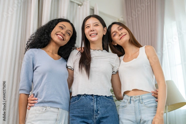 Obraz Diverse group of women friends smiling and talking together, happy female friendship bonding joyful conversation and connection, empowerment support, trust and love, laughter positivity at home