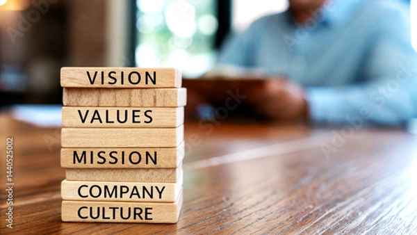 Fototapeta Enhancing Human Resource Strategies Building Vision Values and Mission with Labeled Wooden Blocks in a Corporate Environment