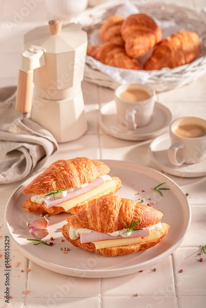 Obraz Tasty and healthy french croissant with cheese, ham and garlic.