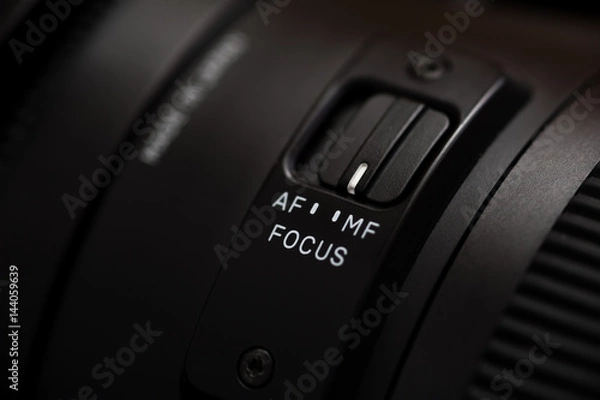 Fototapeta Detailed photo of black lens with buttons