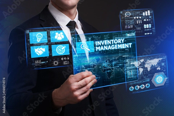 Fototapeta Business, Technology, Internet and network concept. Young businessman working on a virtual screen of the future and sees the inscription: Inventory management
