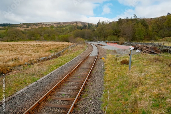 Fototapeta A train track running through the welsh countryside