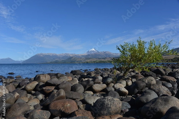 Fototapeta beach of lago huechulafquen and peak of lanin volcano at lanin national park, patagonia, argentina