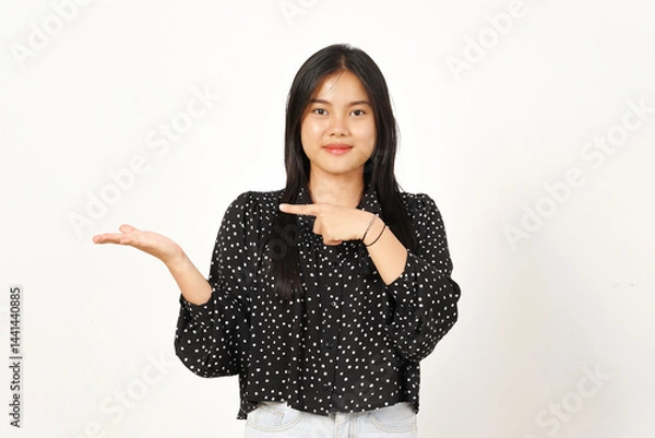 Obraz Showing and Presenting Product on Open Palm Of Beautiful Asian Woman Wearing black Isolated On White Background