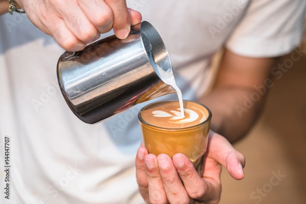 Fototapeta Making of cafe latte art, leaf shape
