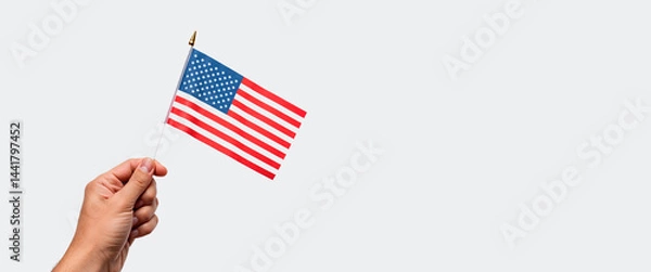 Obraz Hand holding American flag against plain background  