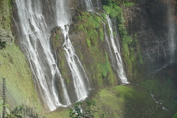 Fototapeta Cascading waterfalls nature paradise scenic view lush greenery aerial perspective breathtaking landscape photography