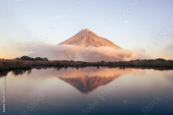 Obraz New Zealand landscape of Mt Taranaki at sunset with lake and reflection