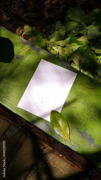 Obraz plain a4 poster paper mockup with green nature outdoor background