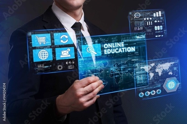 Fototapeta Business, Technology, Internet and network concept. Young businessman working on a virtual screen of the future and sees the inscription: Online education