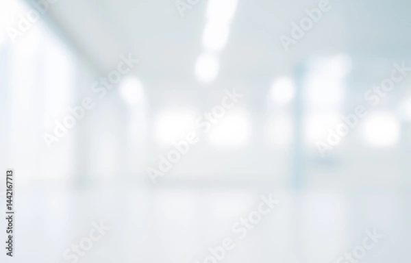 Fototapeta Blurred interior space with white walls and bright lighting creating a soft background.