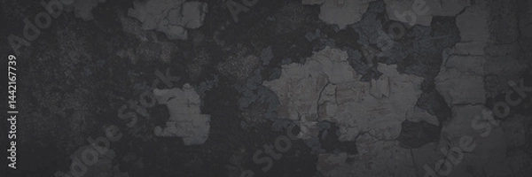 Fototapeta Dark wide panoramic background. Peeling paint on a concrete wall. Faded dark texture of old cracked flaking paint. Weathered rough painted surface with patterns of cracks. Shaded background for design