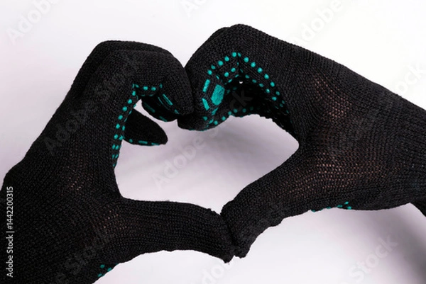 Fototapeta Hands in gloves forming heart shape on white background - futuristic gesture with digital glove pattern
