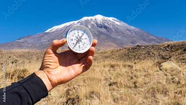 Fototapeta Round compass in hand on the background of Mount Ararat. Concept for travelling and active lifestyle.