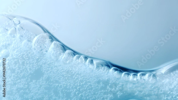 Fototapeta Close-up of water droplets on a light blue background, capturing freshness, purity, and a clean aesthetic, ideal for skincare, hydration, or environmental themes.
