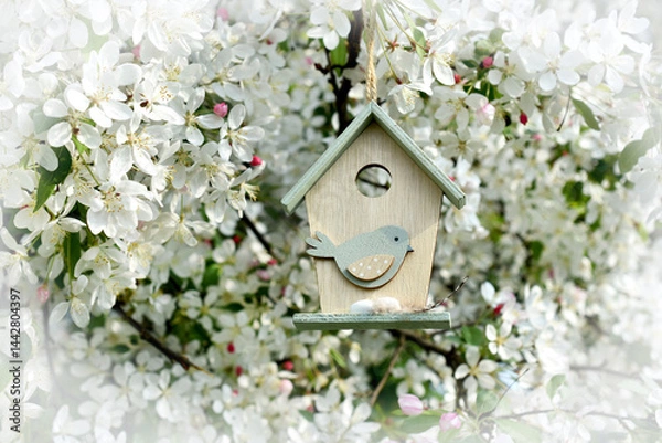 Obraz Wooden birdhouse decor hanging on spring apple tree blossoms