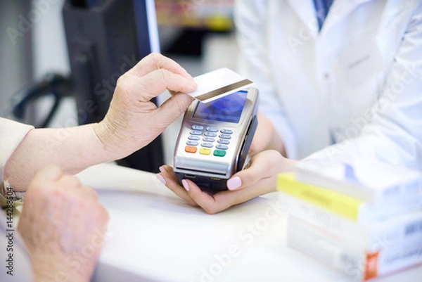 Obraz Close up of contactless payment at pharmacy .