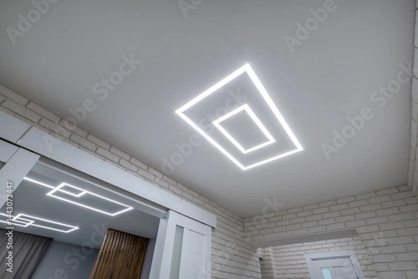 Fototapeta suspended ceiling with halogen spots lamps in form of squares and rectangles and drywall construction in empty room in apartment or house. Stretch ceiling white and complex shape.