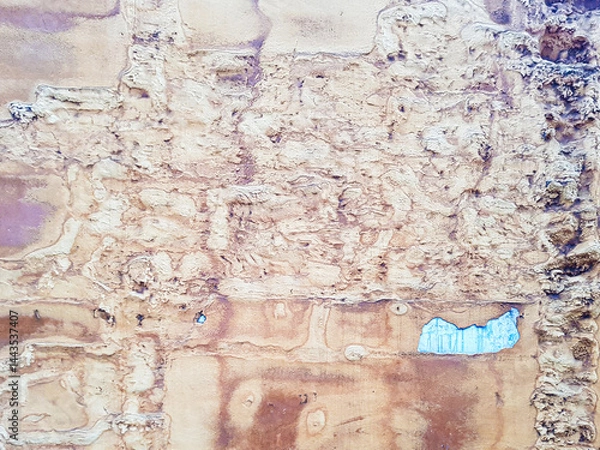 Obraz Close-up of a weathered wall showcasing an array of textures and colors. The surface displays peeling paint and intricate patterns, highlighting age and neglect, creating a unique visual story