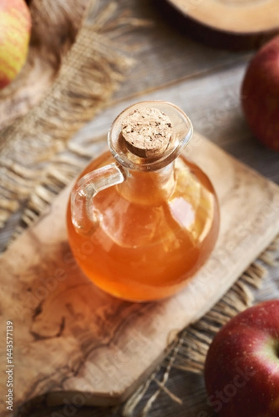 Fototapeta Apple cider vinegar in a glass jug