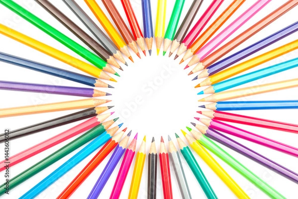 Fototapeta Multicolored pencils arranged in a circular pattern against a white backdrop, forming a central frame. Ideal for artistic projects, school supplies, or creative design concepts.