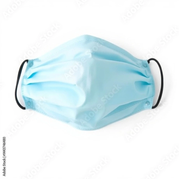 Obraz Light blue medical face mask with elastic ear loops on a white background, emphasizing hygiene and protection in healthcare and daily settings