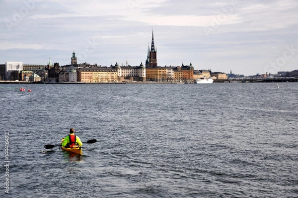 Obraz  Cityscape of Stockholm with Canoe kayak flowing in the river.