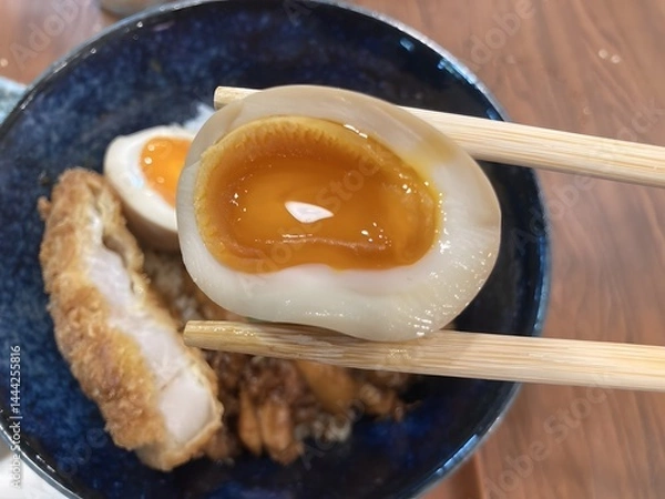 Obraz Soft boiled egg on a chopstick