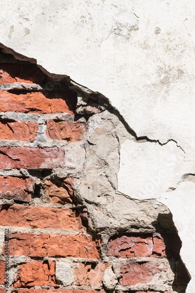 Obraz Through a hole in a wall it is visible bricks