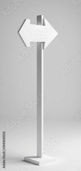 Obraz A clean, white directional sign featuring a bold arrow pointing to the right, set against a natural backdrop, indicating a clear path or destination.