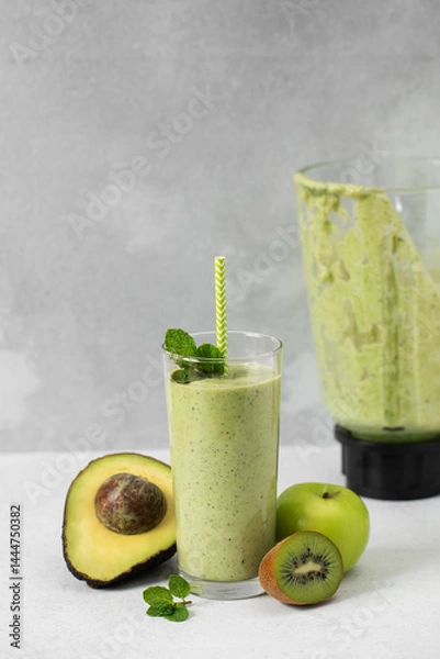 Obraz Refreshing avocado kiwi smoothie with apple and mint for a nutritious breakfast