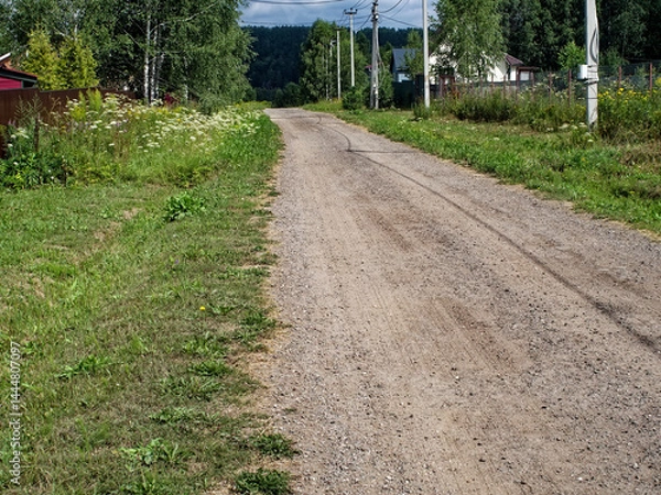 Obraz Dirt road in a holiday village in summer